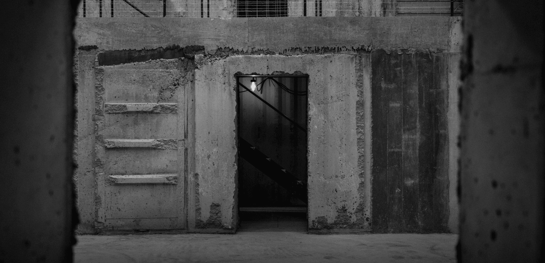 Interior of the Elektra artwork by Anselm Kiefer; a concrete structure, showing a doorway and second level with a railing
